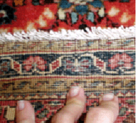 rug with worn fringe