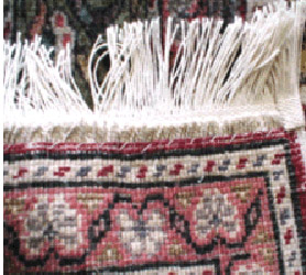 rug with repaired fringe